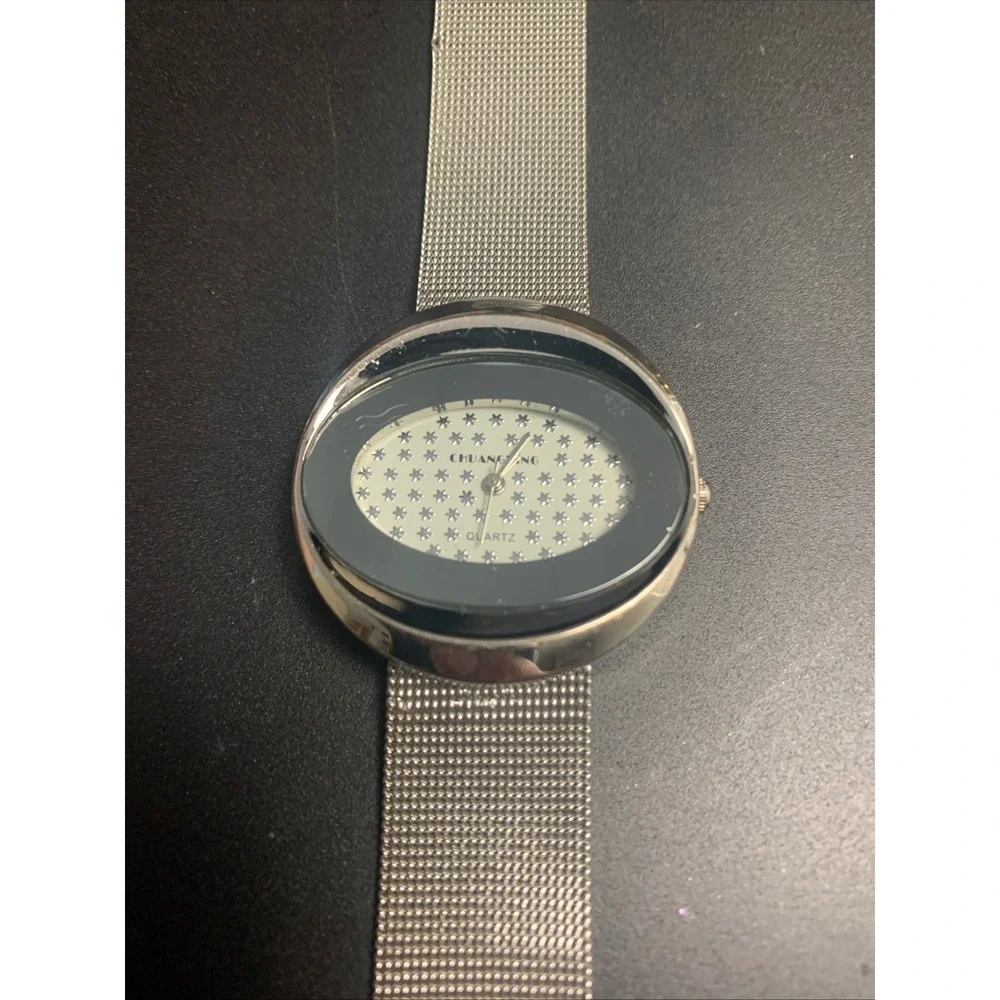 Chuangang Women Quartz Watch Silver Mesh Band Oval Black Star Dial 114